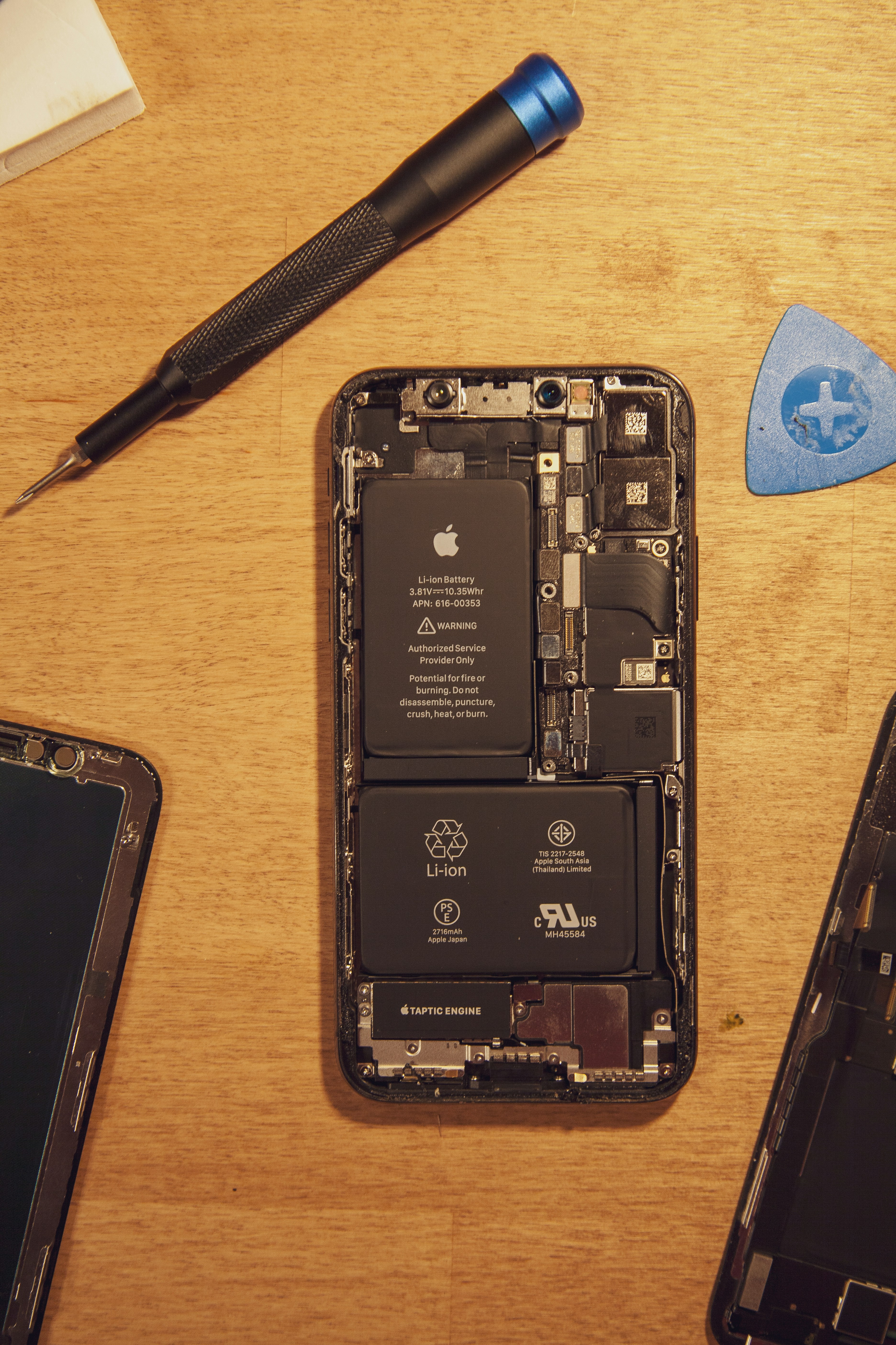 Disassembled iPhone with repair tools